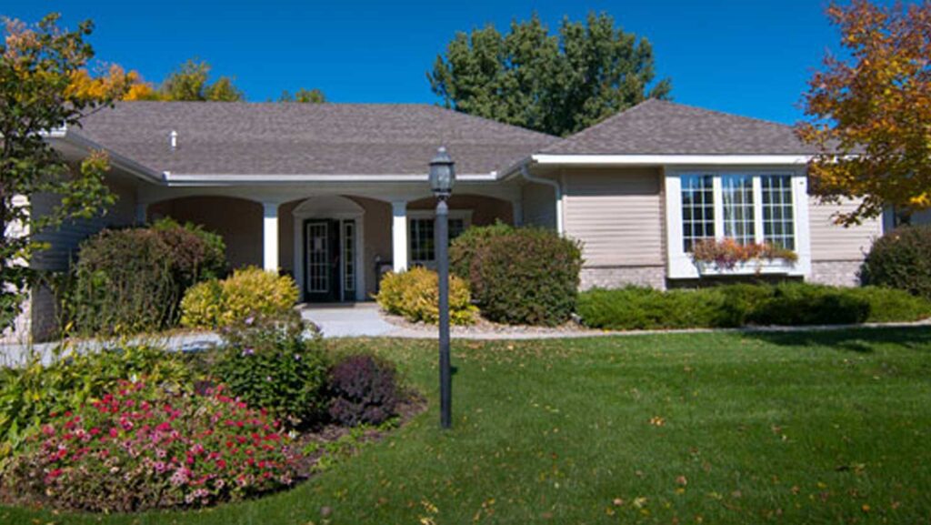 Exterior view of an Emerald Crest memory care home designed with a welcoming, residential setting that encourages connection, comfort, and daily engagement.